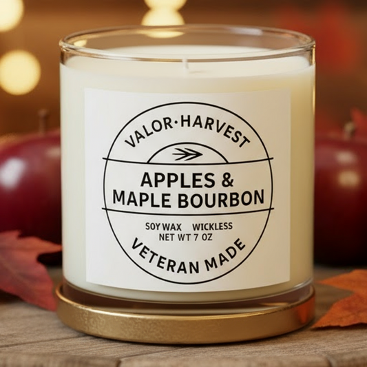 Apples and maple bourbon wick free candle in a clear glass jar.