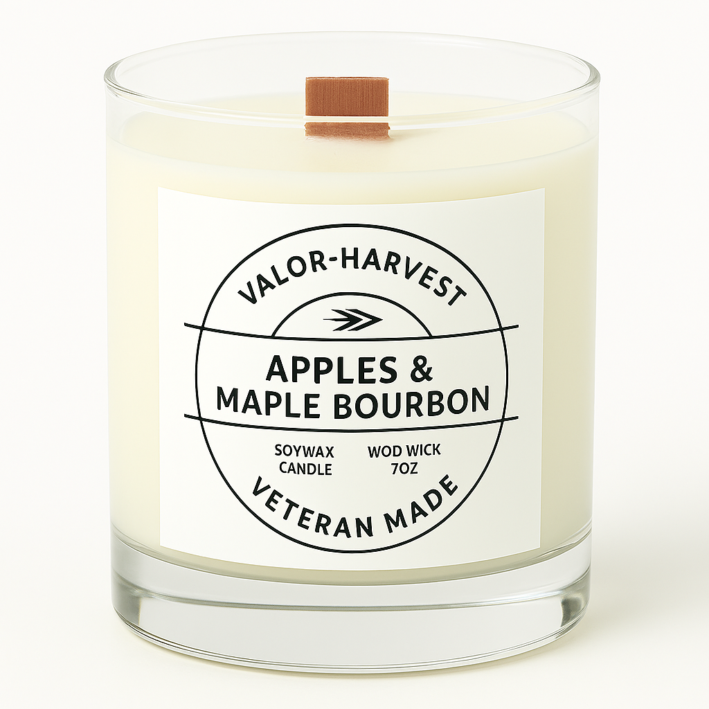 Candle with a label reading 'Apples & Maple Bourbon' by Valor Harvest on a white background