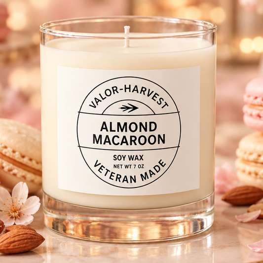 Valor+Harvest Almond Macaroon soy wax candle surrounded by macarons and almonds.