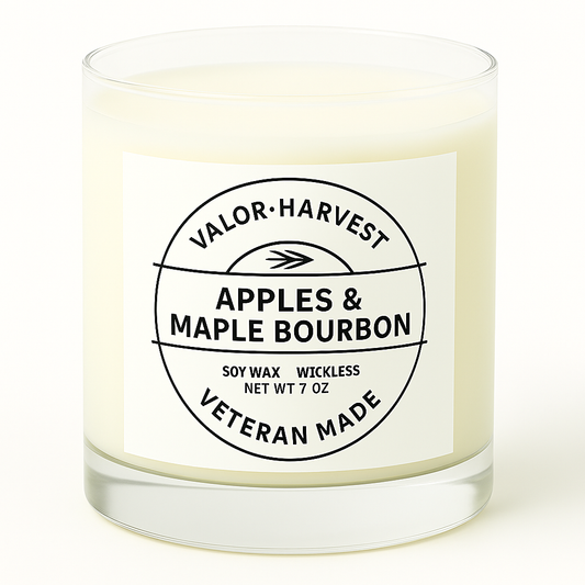 Candle with a label reading 'Apples & Maple Bourbon' by Valor Harvest on a white background