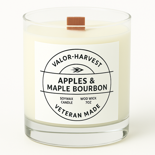 Candle with a label reading 'Apples & Maple Bourbon' by Valor Harvest on a white background