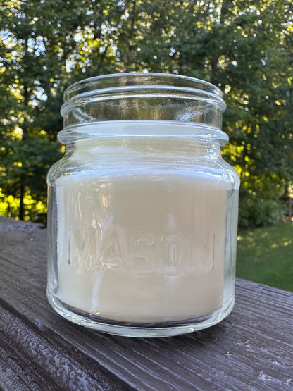 Valor+Harvest Butterscotch & Bourbon soy coconut wax candle in a glass mason jar outdoors