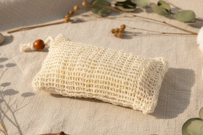 Sisal soap holder, cloth material, used for holding soap and creating lather when applied to water. 