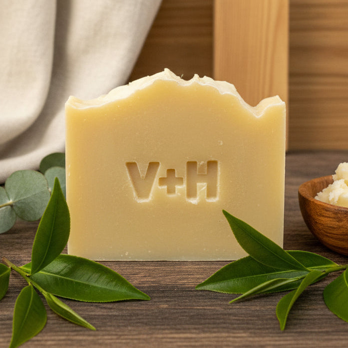 Bar of soap with 'V+H' branding on a neutral background, Teal Tree and Lavender Scent. 