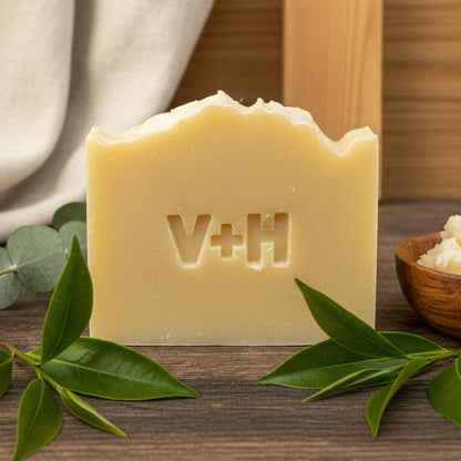Bar of soap with 'V+H' branding on a neutral background, Teal Tree and Lavender Scent. 