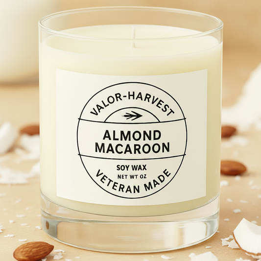 Almond macaron candle, white glass front view. 