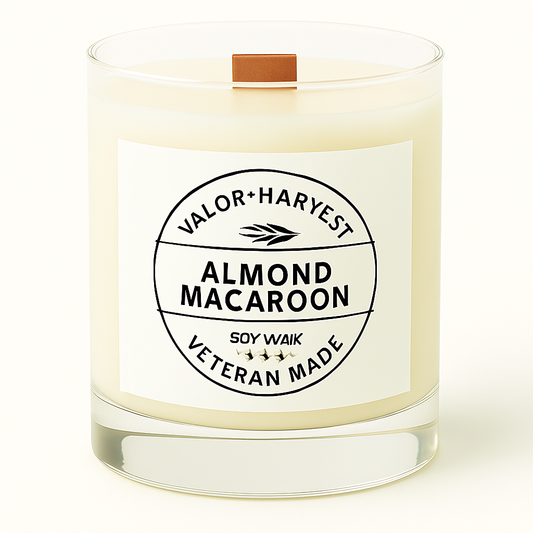 Candle with a label reading 'Almond Macaroon' by Valor Harvest on a white background