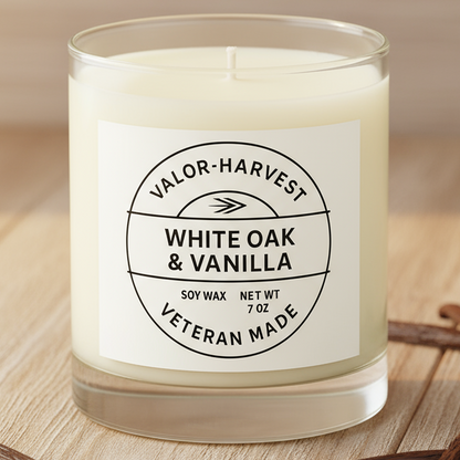 White oak and vanilla scented candle, in a white glass jar. 
